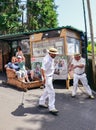 Monte, Madeira, Portugal - Sep 14, 2019: Wicker Basket Sledges drivers, Carreiros do Monte, driving people downhill. Historical