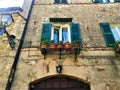 Montecassiano town, Marche region, Italy. Medieval buildings, windows, cat, plants,  beauty, history and time Royalty Free Stock Photo