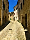 Montecassiano town, Marche region, Italy. Medieval buildings, precious ancient street, beauty, history and time