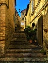 Montecassiano town, Marche region, Italy. Narrow ancient street, medieval buildings, history and time