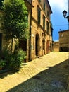 Montecassiano town, Marche region, Italy. Medieval buildings, ancient street, beauty, history and time