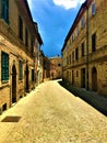 Montecassiano town, Marche region, Italy. Medieval buildings, ancient street, light, beauty, history and time Royalty Free Stock Photo