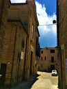 Montecassiano town, Marche region, Italy. Medieval buildings, precious ancient square and car, beauty, history and time