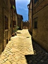 Montecassiano town, Marche region, Italy. Narrow ancient street, medieval buildings, history and time