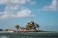 MONTEGO BAY, JAMAICA - JANUARY 09, 2017: Small Paradise island for tourists with palms, beach, big stones and beach plank beds for