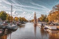 The Montelbaanstoren tower on Oudeschans canal in Amsterdam, Netherlands