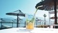 Montenegro 12.06.2019 Beach, mojito cocktail on the background of umbrellas Royalty Free Stock Photo