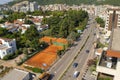 Montenegro - Budva: September 6, 2021: Aerial view of Budva city with road traffic. Main Street of touristic town with