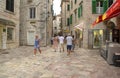 Montenegro - Budva: September 8, 2021: Old town of Budva with walking tourists. Heritage site of walled city with