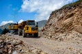 Montenegro, Cetinje - June, 29, 2017: Dump truck laden with stone on a mountain road