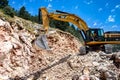 Montenegro, Cetinje - June, 29, 2017:Excavator CAT on a stone mountain road