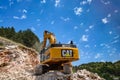 Montenegro, Cetinje - June, 29, 2017:Excavator CAT on a stone mountain road