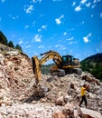 Montenegro, Cetinje - June, 29, 2017:Excavator CAT works on a stone mountain road