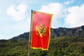 Montenegro flag in a front of mountains