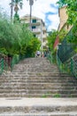 Tourists are walking along the narrow streets of the old city. Royalty Free Stock Photo