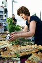 Montenegro, Herceg Novi - 18/06/2016: A woman prepare a table with treats for the guests