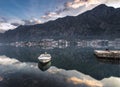 Montenegro kotor bay reflection mountains solo boat