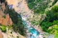 Montenegro mountains landscape . The blue river flows in a deep canyon among the high mountains covered with green forest Royalty Free Stock Photo