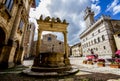 MONTEPULCIANO SQUARE. FOUNTAIN AND CITY HALL. BEAUTYFUL IDYLLIC TUSCNAY HISTORIC CITYSCAPE.