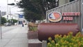 Monterey, California, Cannery Row road sign, tourist landmark. Bay aquarium. Royalty Free Stock Photo