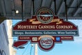 Monterey Canning Company sign advertises shops, restaurants, galleries and wine tasting at Cannery Row - Monterey, California, USA