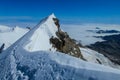 Monterosa traverse knife edge snow ridge glacier walk and climb in the Alps Royalty Free Stock Photo