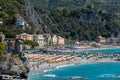 Italy, Monterosso, beach and parasols in front of the giant, statue of the giant god Poseidon or Neptune Royalty Free Stock Photo