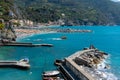 Italy, Monterosso,Italy, Monterosso, beach and parasols in front of the giant, statue of the giant god Poseidon or Neptune Royalty Free Stock Photo