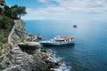 MONTEROSSO, ITALY - JUNE 20, 2016: Sightseing boat moored in Monterosso al Mare, one of villages of Cinque Terre, Liguria. UNESCO Royalty Free Stock Photo