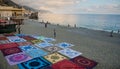 Womens beach dresses and towels for sale on the ground in the beach of Monterosso Chinque Terre Italy