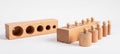 Montessori knobbed wooden cylinders with blocks. Children puzzle for development of dimension perception