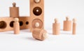 Montessori knobbed wooden cylinders with blocks. Kids puzzle for development of eye hand coordination and concentration