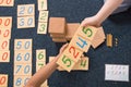 Montessori learning with numbers on wooden blocks