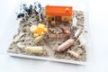 Montessori material. Children`s hands play an animal figure. Kinetic sand