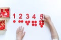 Montessori material. Children`s hands. The study of mathematics Royalty Free Stock Photo