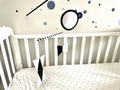 Montessori Munari Mobile carousel hanging and spinning above baby bed. Black and white geometrical shapes that improves babies Royalty Free Stock Photo