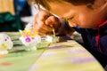 In Montessori schools, children practice art by painting plaster sculptures