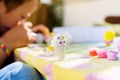 In Montessori schools, children practice art by painting plaster sculptures
