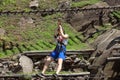 Montestrutto, Italian alps - June 2020: a girl throws herself into a rope-smeared cliff in an adventure park