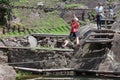 Montestrutto, Italian alps - June 2020: a girl throws herself into a rope-smeared cliff in an adventure park