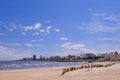 Montevideo beach with sand fence barriers and skyline on a sunny day, Montevideo, Uruguay Royalty Free Stock Photo