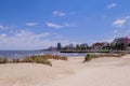 Montevideo beach with sand fence barriers and skyline on a sunny day, Montevideo, Uruguay Royalty Free Stock Photo