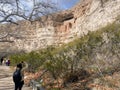 A woman taking a photo Montezuma Castle at the National Monument Royalty Free Stock Photo