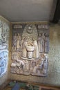 Montfort-sur-Meu, France, September 9, 2016: Ceramics on the wall of the MAISON NATALE home depicting the baptism of Saint