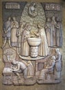 Montfort-sur-Meu, France, September 9, 2016: Ceramics on the wall of the MAISON NATALE home depicting the baptism of Saint