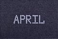 Month APRIL is made rhinestones crystal color on a black canvas