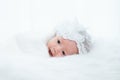 0-1 month Asian newborn baby lie down on white fur background or soft blanket, toddler infant open eye after long sleeping, baby Royalty Free Stock Photo