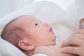 0-1 month Asian newborn baby looking to her mom with curiosity, infant open eye effect with light but still not see anything, baby Royalty Free Stock Photo