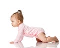 8 month infant child baby girl toddler learning how to crawl in pink shirt looking at corner Royalty Free Stock Photo