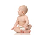 8 month infant child baby girl toddler sitting on floor in diaper isolated on a white Royalty Free Stock Photo